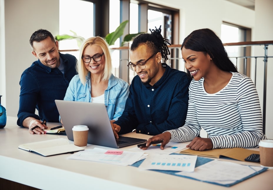 diverse-group-of-colleagues-working-together-at-NVRVQEJ-min